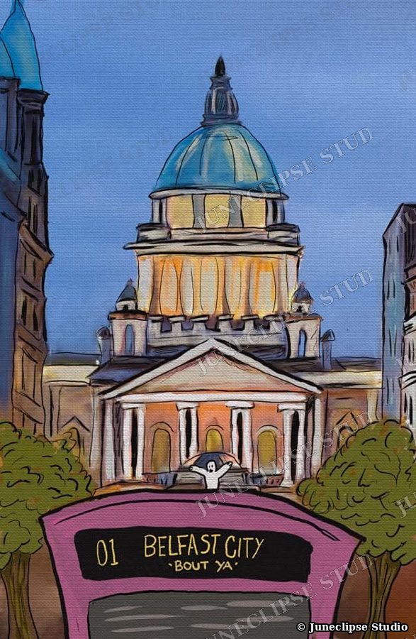 Belfast City Hall at dusk behind a pink city bus